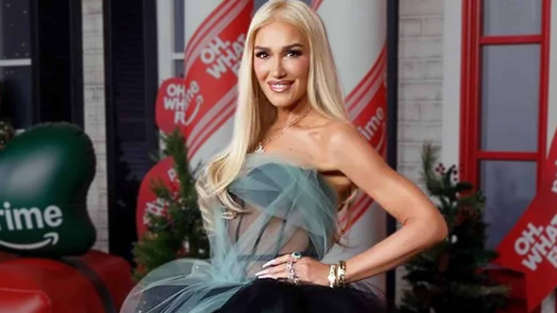 Gwen Stefani arrives solo at the 2025 New York premiere of Oh. What. Fun. in a daring sheer forest-green Vera Wang tulle gown with visible black corset and dramatic black mermaid skirt, fueling Blake Shelton breakup rumors with her bold Christmas-themed look.