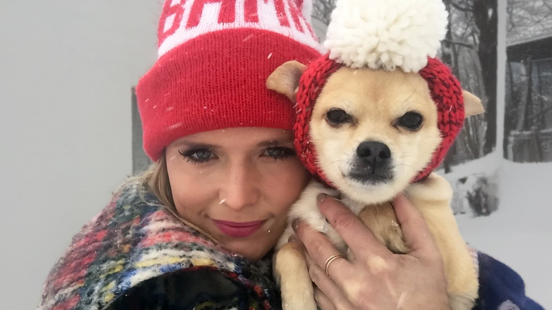 Miranda Lambert holds her beloved chihuahua Cher wearing matching red knit hats in snowy outdoor photo, mourning the loss of her 15-year companion who toured with her and was "worth every tear" in heartfelt 2025 tribute.
