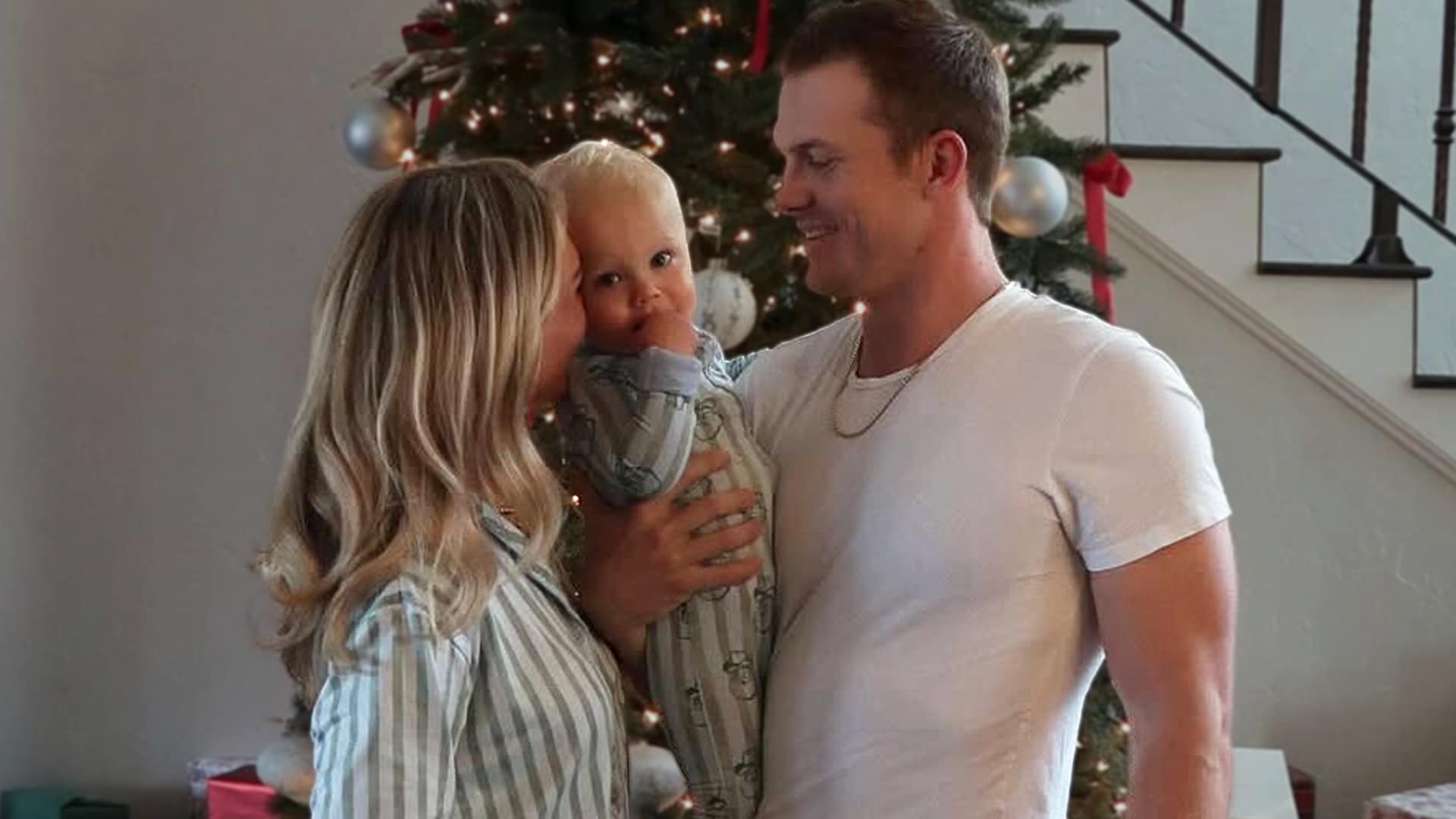 Parker McCollum and wife Hallie Ray Light announce pregnancy with second baby boy due summer 2026, sharing sweet Christmas photo with son Major in front of decorated tree, expanding their family to four.
