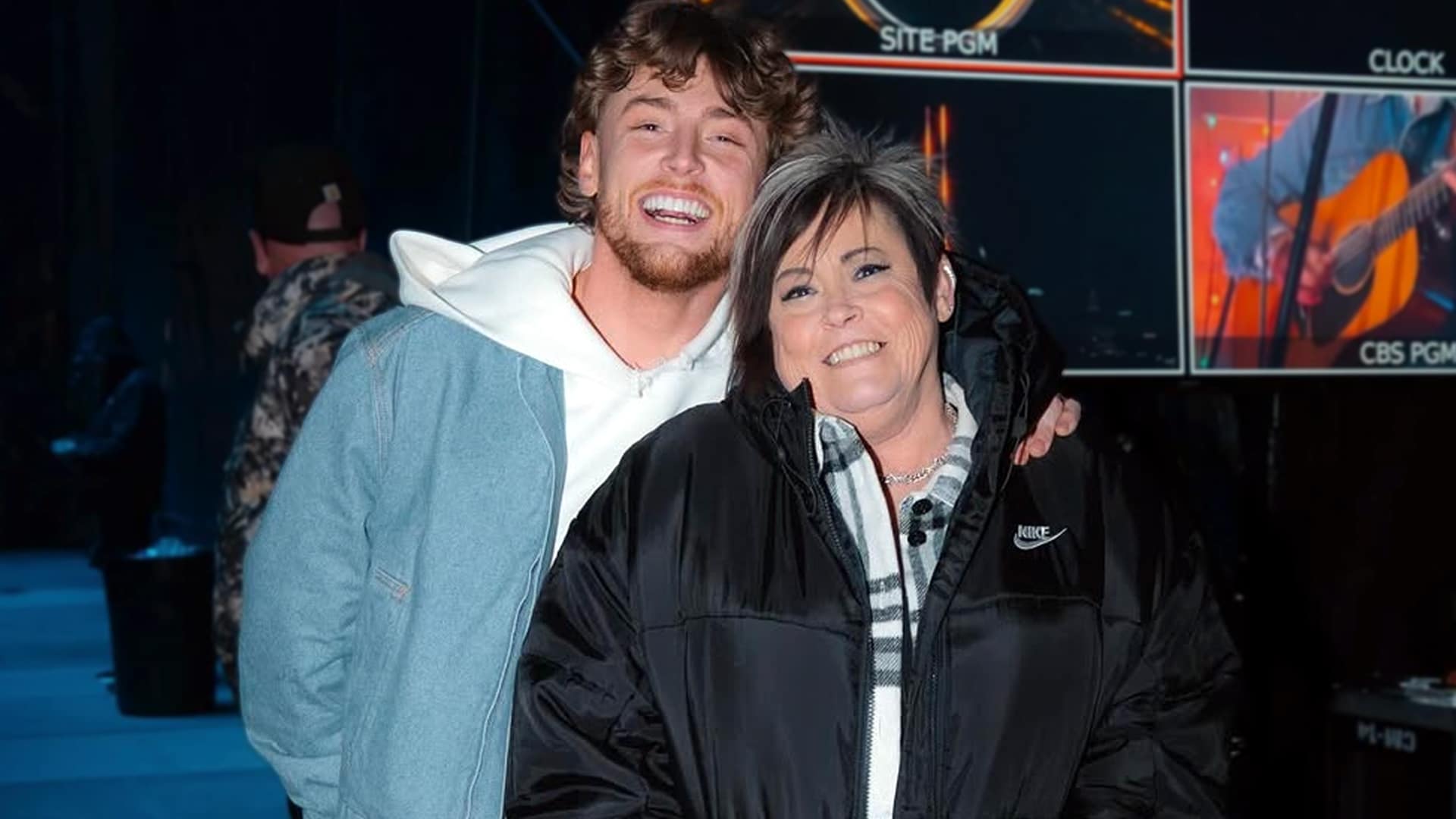 Bailey Zimmerman surprises his mom Dana with her dream house and new white Escalade for Christmas 2025, sharing a joyful hug backstage or on set as he proves fame hasn't changed his roots in heartfelt family moment.
