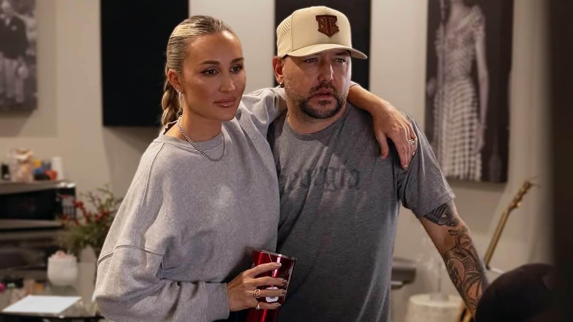 Jason Aldean and wife Brittany Aldean pose together in casual attire, as they release their first-ever duet "Easier Gone" in 2026, a raw breakup ballad showcasing powerful vocals and emotional depth.