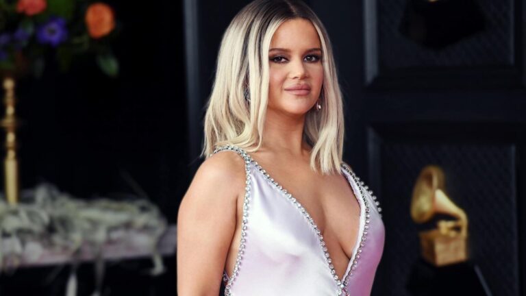 Maren Morris in a sparkling pink gown with dramatic deep V-neck and silver embellishments, as she slams country music as cold and political but now hints at wanting back in after stepping away.