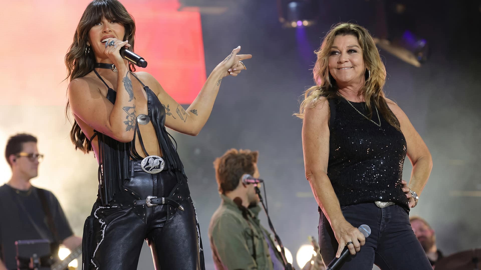 Gretchen Wilson and Ella Langley performing together on stage at CMA Fest, lighting it up with a fiery, high energy duet.