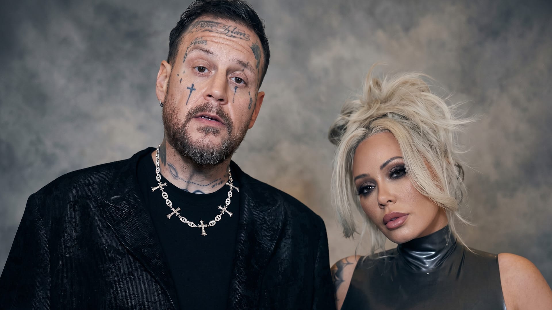 Jelly Roll and Bunnie XO together at a past event, shown alongside news that his divorce filing cites irreconcilable differences as the reason for their split.