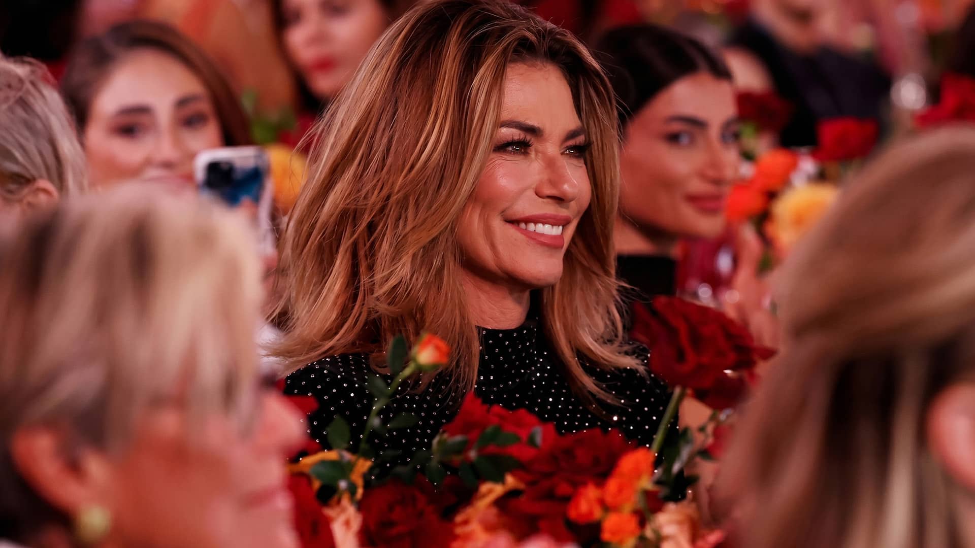 12:20 AM Shania Twain smiling warmly, shown alongside her remarks about why the feminist label has never felt like a fit for her.