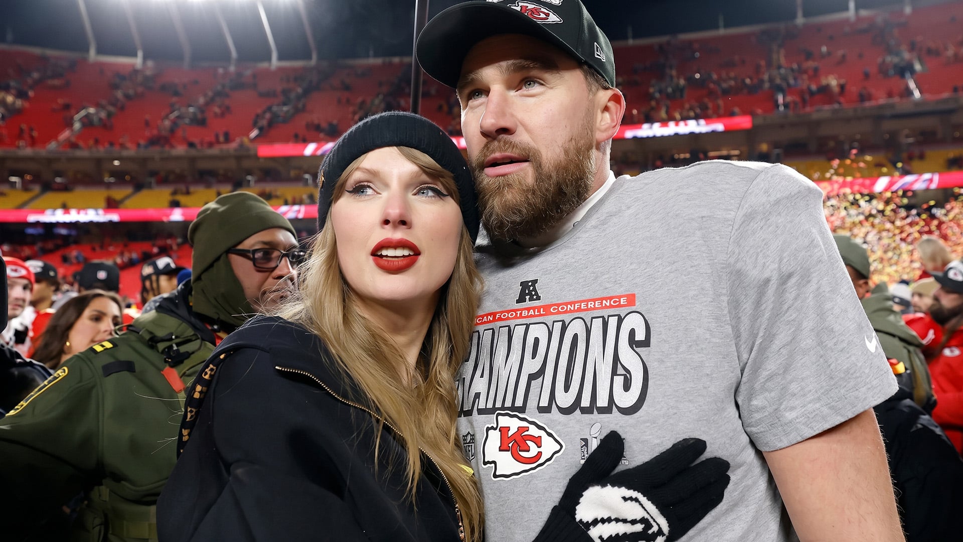 Taylor Swift and Travis Kelce wrapped in a happy embrace, the couple whose upcoming wedding has all of Nashville quietly hoping their invitation is already in the mail.