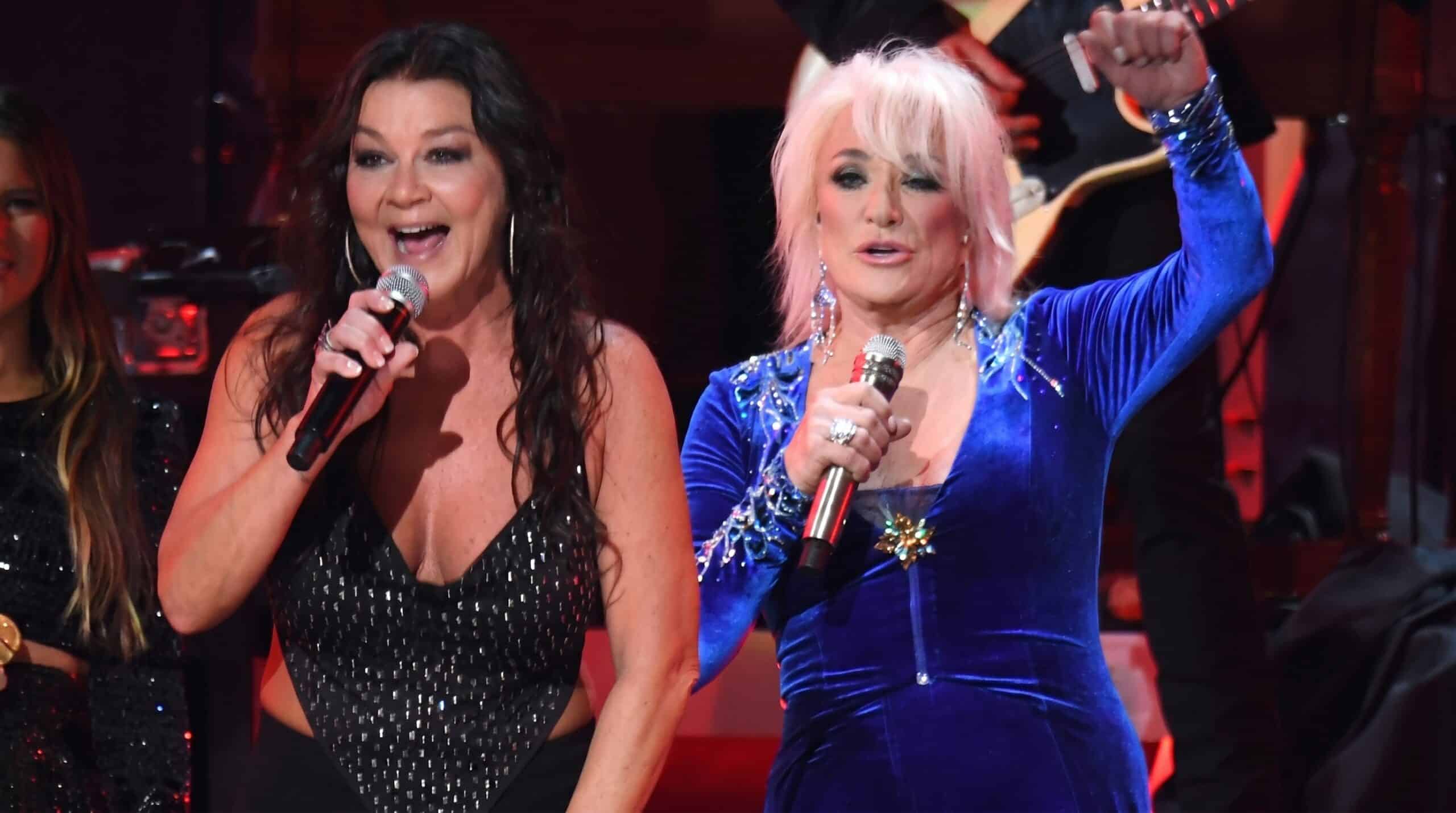 Gretchen Wilson and Tanya Tucker standing together, two generations of outspoken country women sharing the frame.