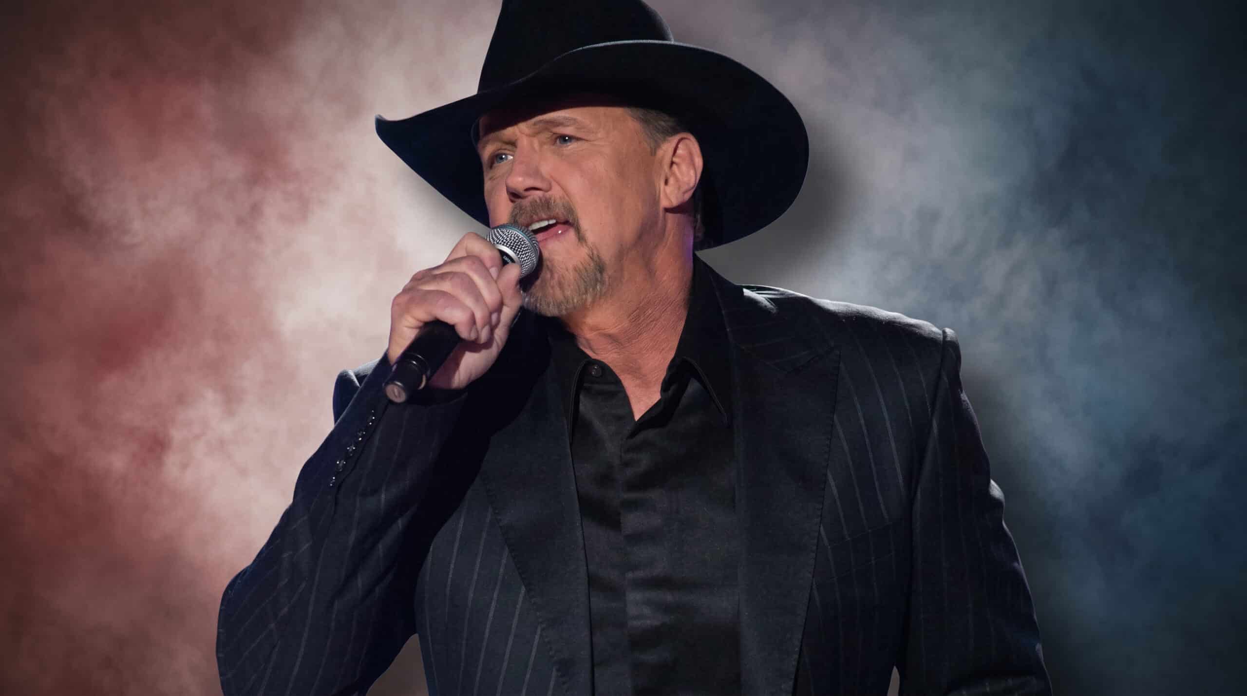 Trace Adkins singing patriotically into a microphone.
