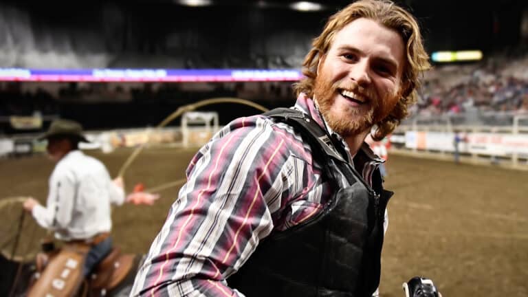 Coy Thorson stands on the race field as the bull rider recalls crying as a child that he didn’t want to compete, yet had no choice but to continue.