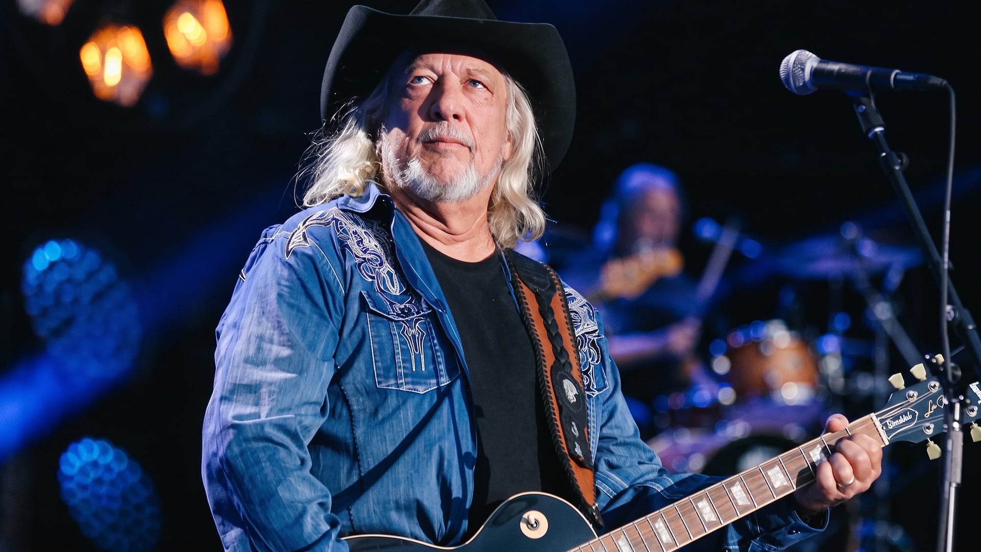 John Anderson performs on stage as the Country Music Hall of Famer known for his distinctive voice is remembered after passing at age 71.
