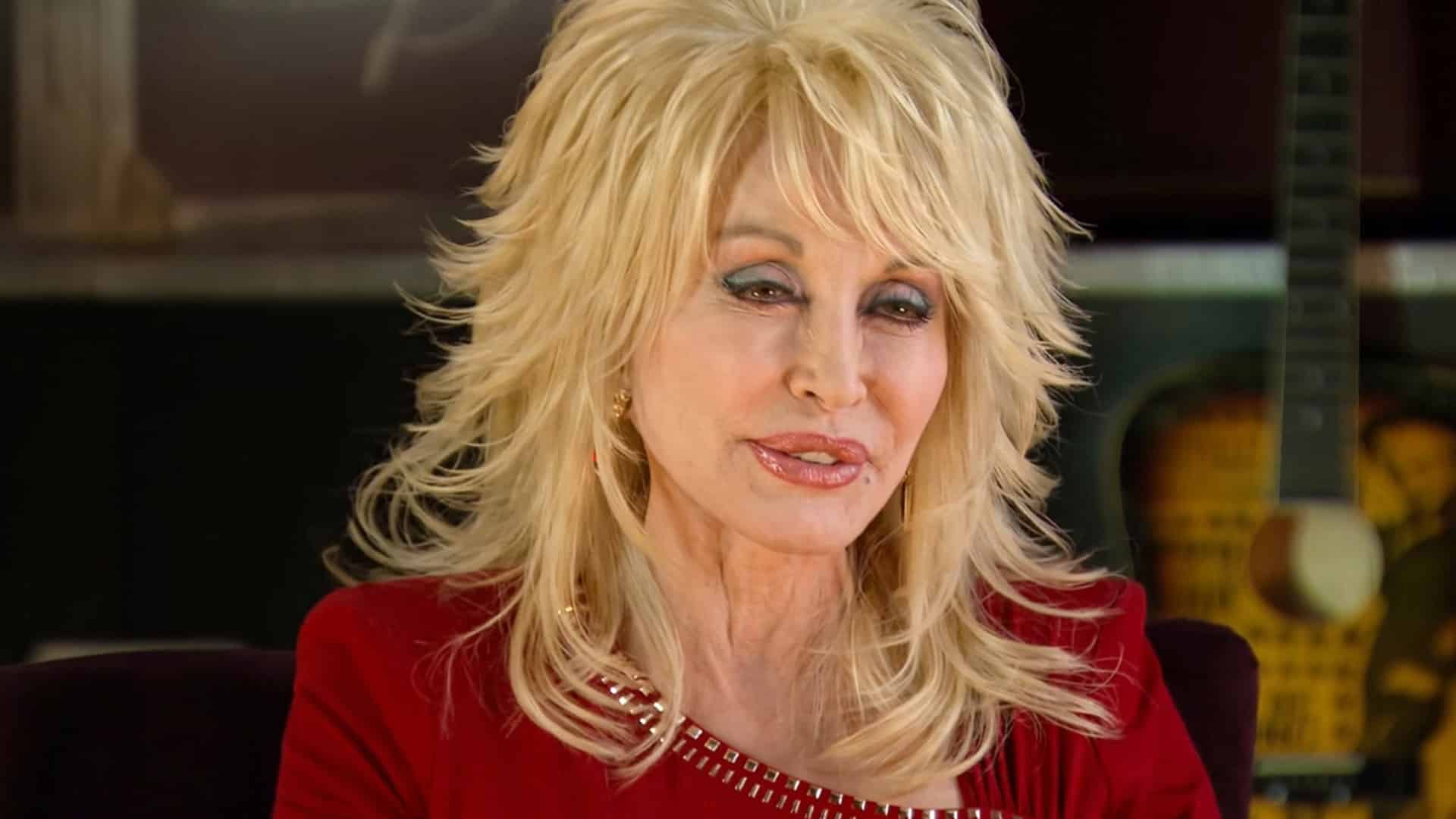 Dolly Parton is shown talking as her secret final song is sealed at Dollywood until her 100th birthday in 2046.
