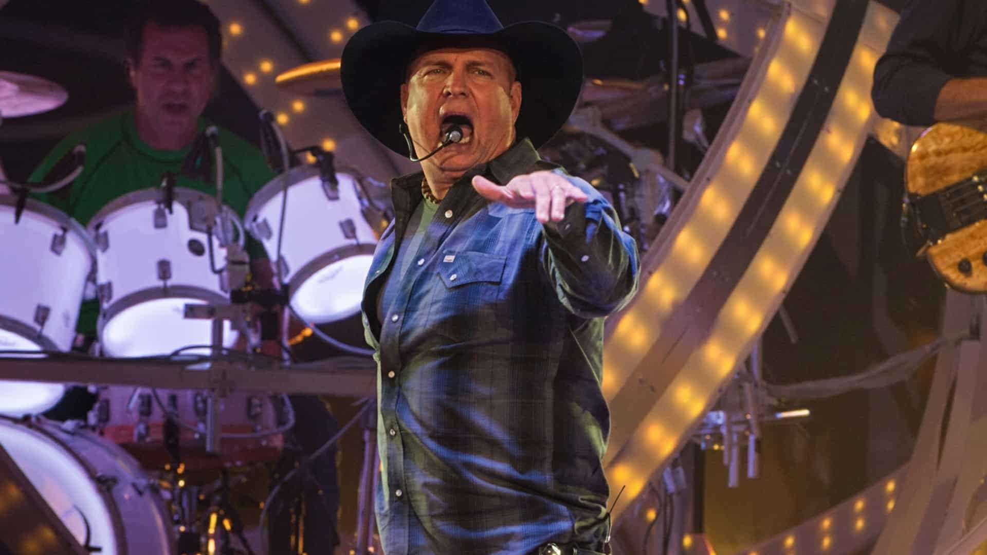 Garth Brooks is shown on stage as the country legend jokes he’d weigh 200 pounds less riding rodeo and admits his hit “Rodeo” wasn’t meant for him.