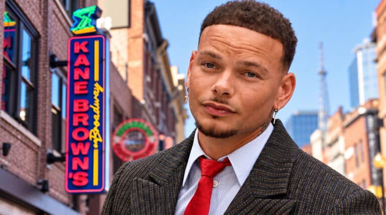 A photo of Kane Brown with his Nashville bar in the background as the Broadway spot faces a $2.4 million lawsuit months after opening.
