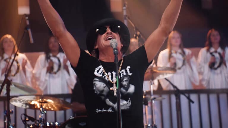 Kid Rock is shown worshiping in his music video as he admits AI helped build the choir on his gospel album Halfway 2 Jesus and calls it another tool.