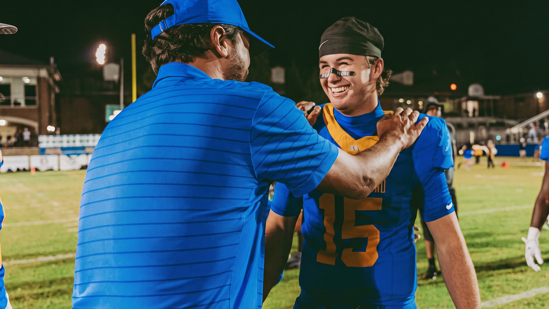 Luke Bryan stands with his son Bo as the high school senior suffers a collarbone injury in the season he long anticipated, then offers fans a promise.