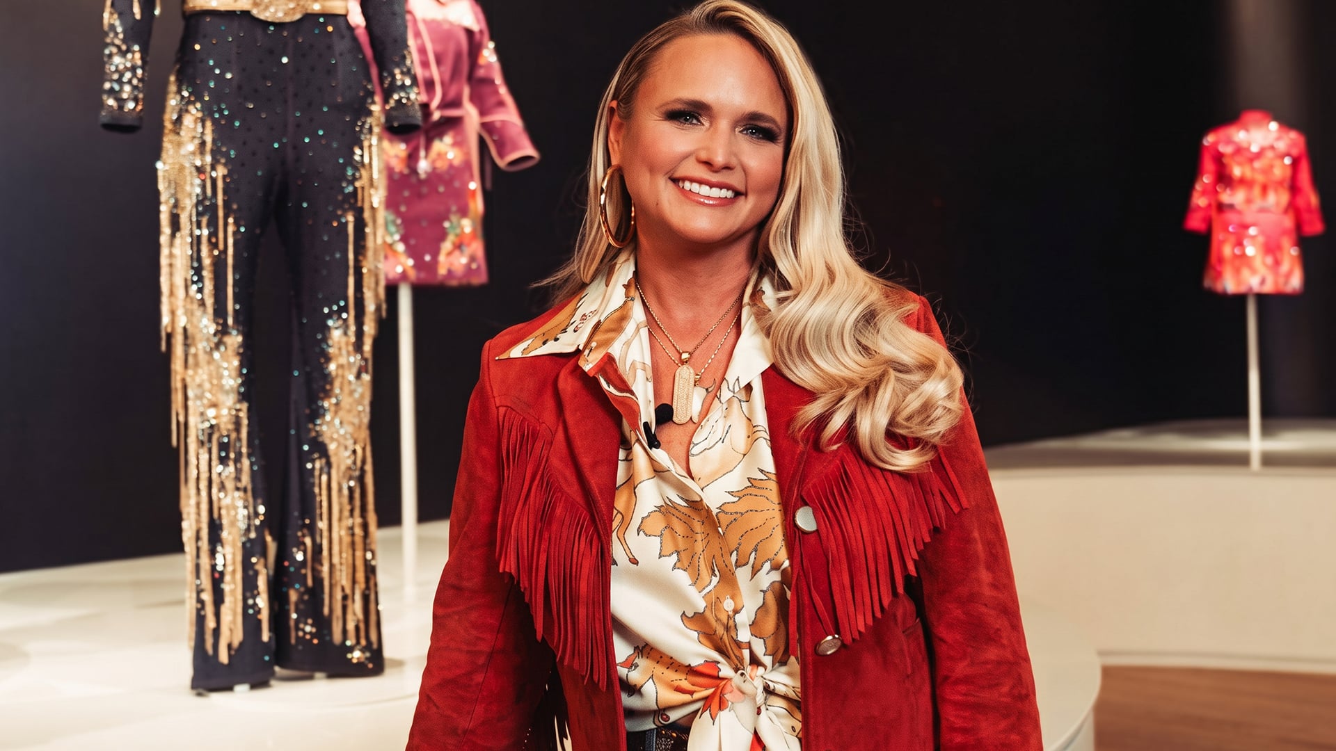 Miranda Lambert stands behind her velvet tour clothes as the Velvet Rodeo wardrobe lands at the Cowgirl Museum that inspired it and she calls it full circle.