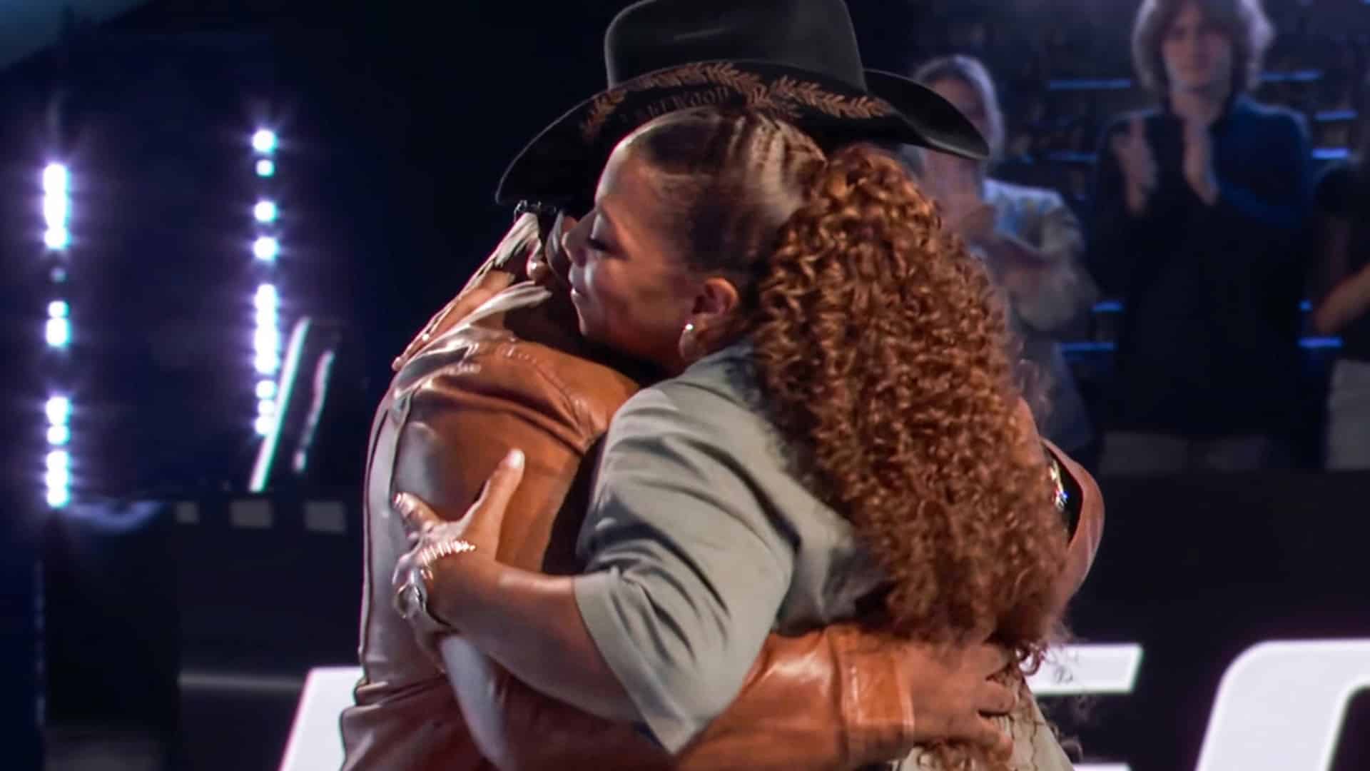 Queen Latifah is shown hugging BigCountry after picking him over Luke Cope in the Tennessee Whiskey battle on The Voice.