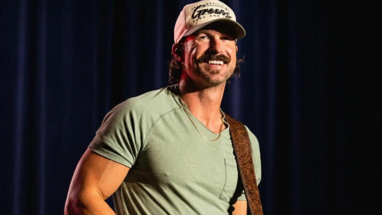 Riley Green performs onstage as he admits he never liked his voice and names what really opened the door to his career.