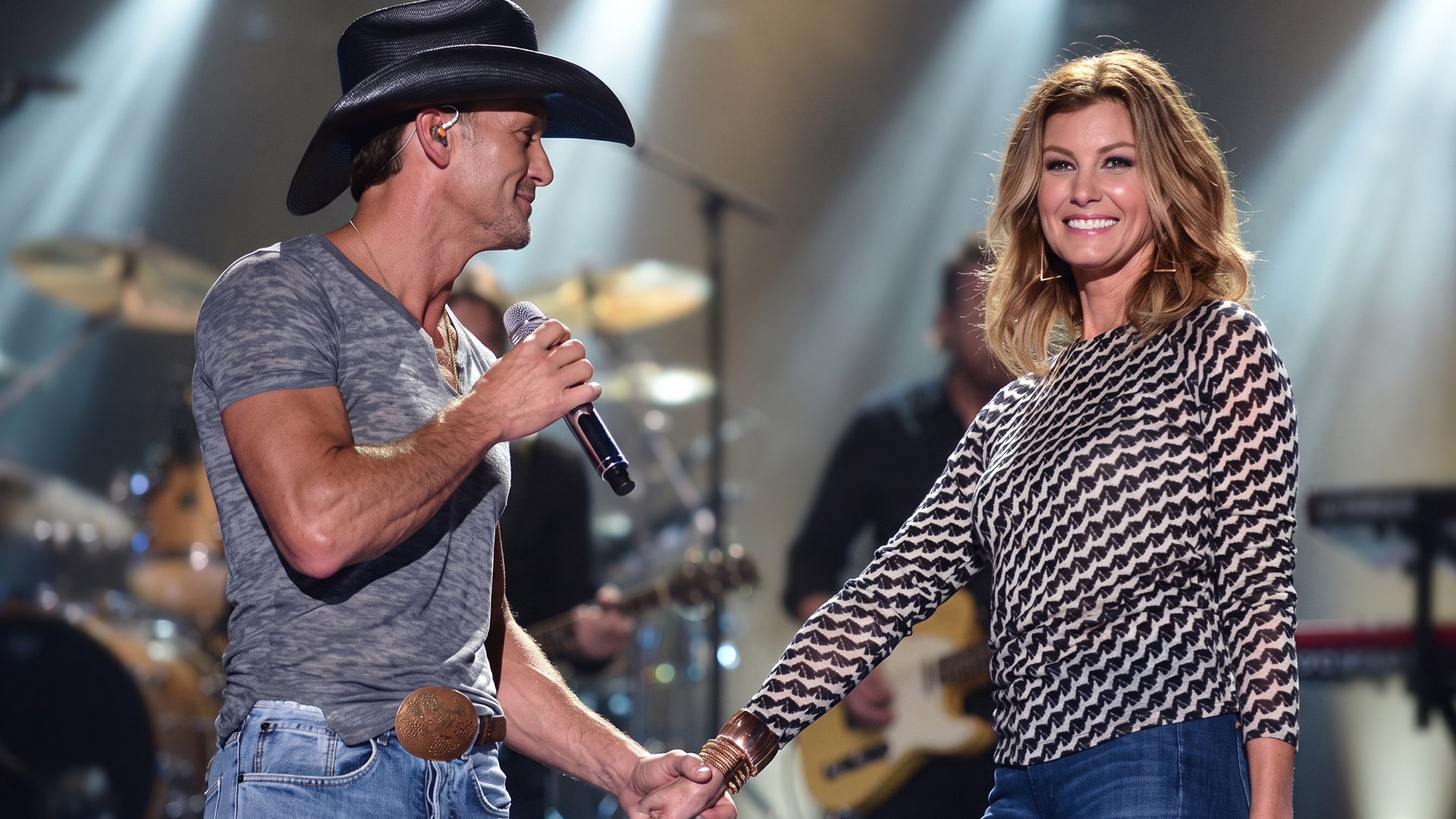 A photo of Tim McGraw and Faith Hill performing happily shows the couple who took home a Grammy while married for the song “Like We Never Loved at All.”
