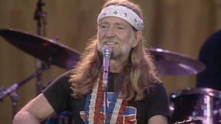 A photo of young Willie Nelson performing after his IRS Tapes album was made from something the government had already taken from him.